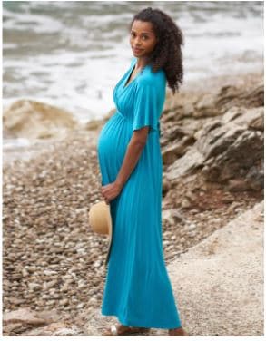 pregnant woman wearing long blue nursing dress